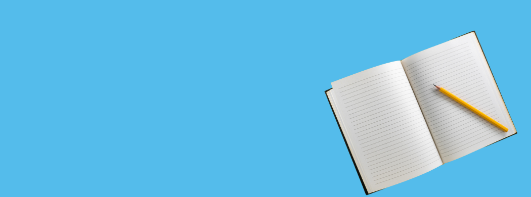 blank notebook on blue background