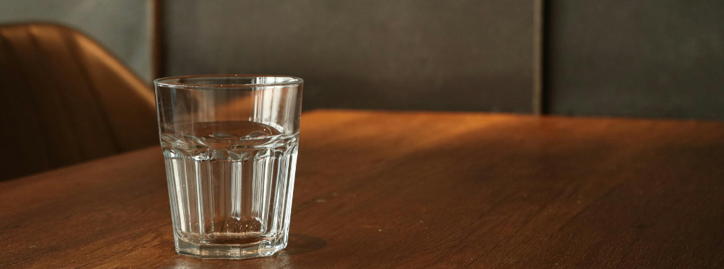 empty glass on conference table