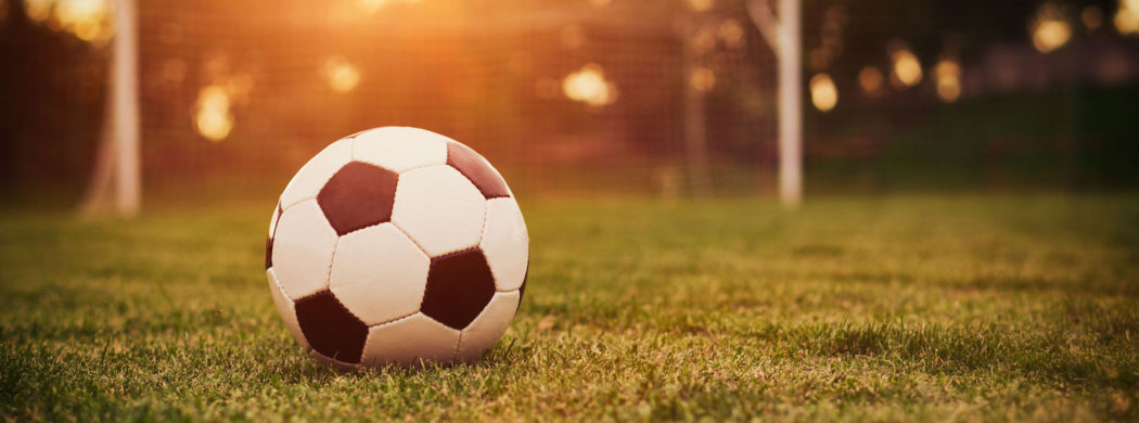 feature-soccer-ball-and-goal-1050x390