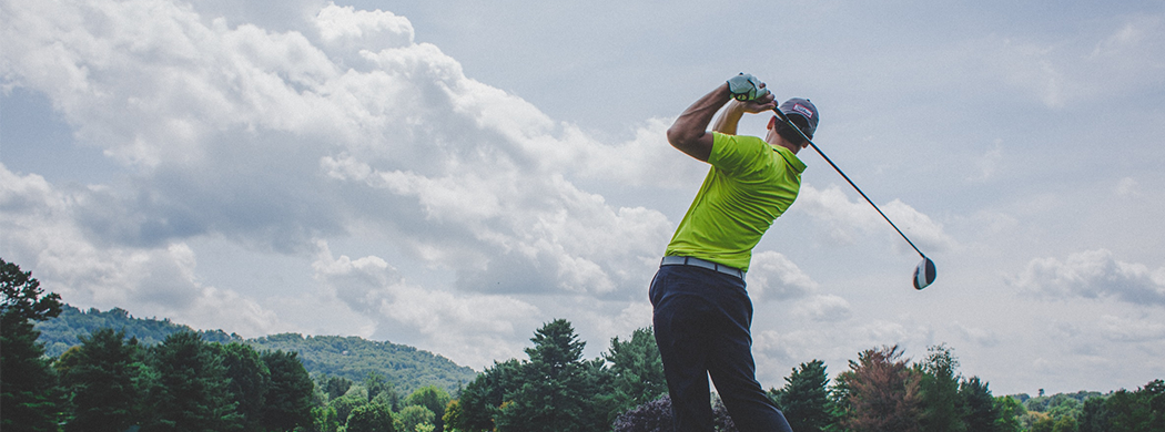 Golfer mid-swing